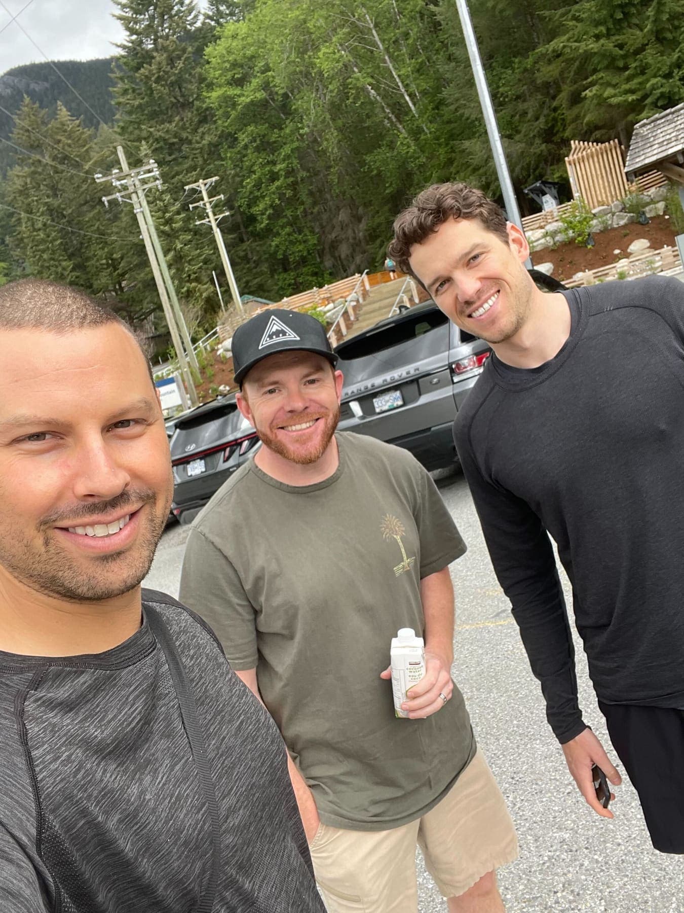 Three teammates on a road trip through the mountains in British Columbia