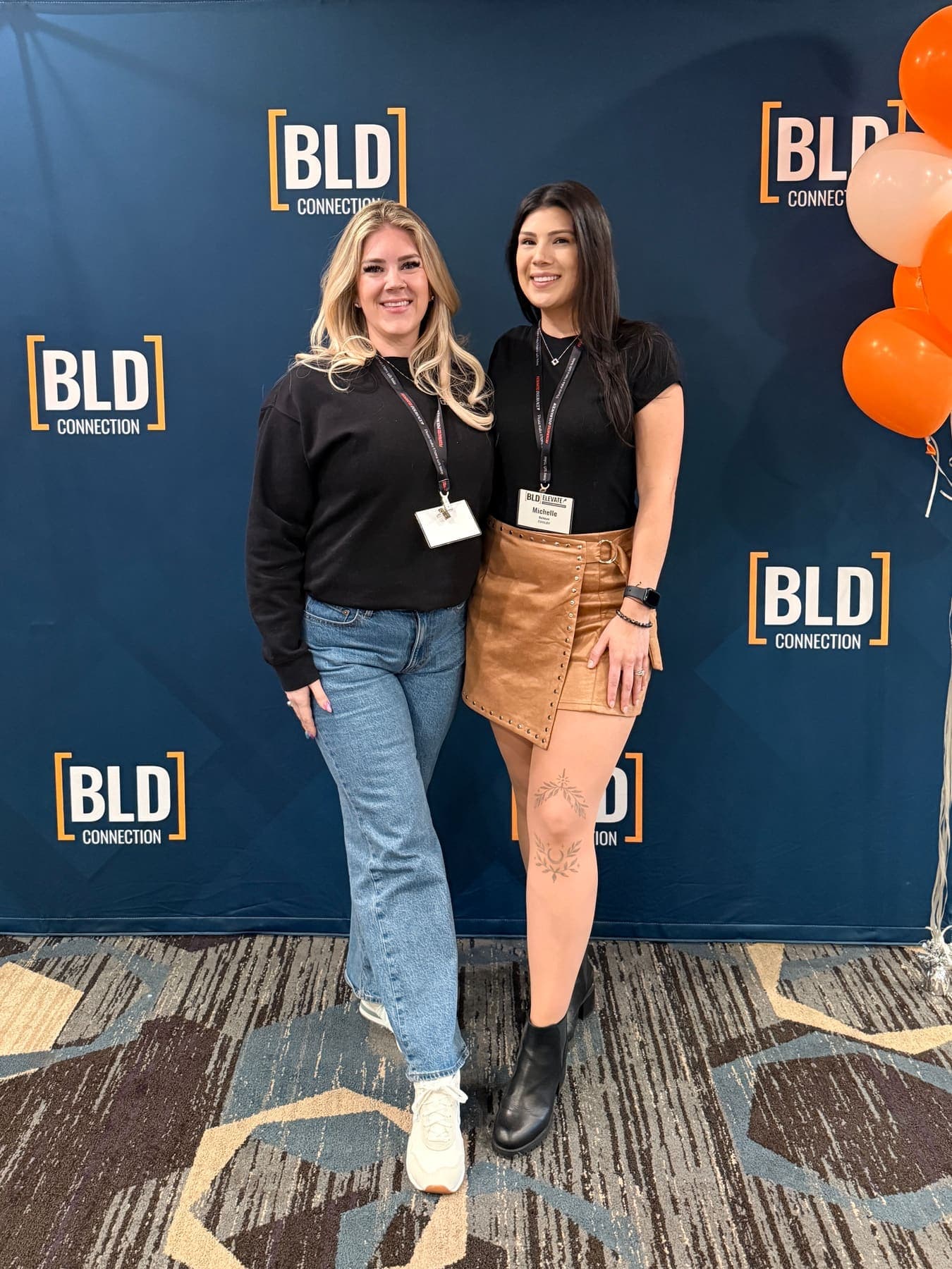 Two teammates on the floor at the BLD Connection industry show