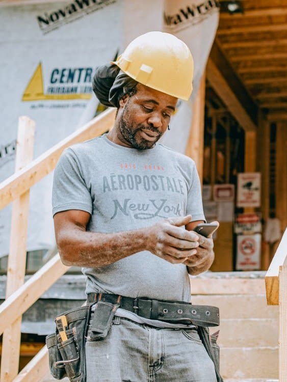 A contractor on the phone, placing an order from a job site.