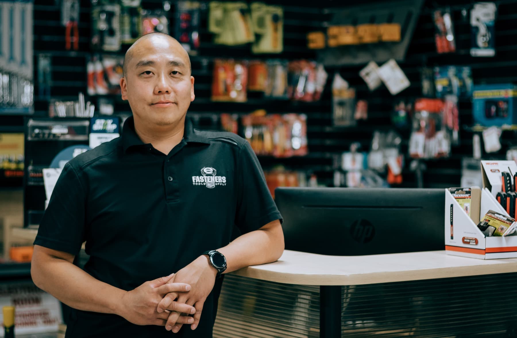A dealer's counter staff helping a customer with an order