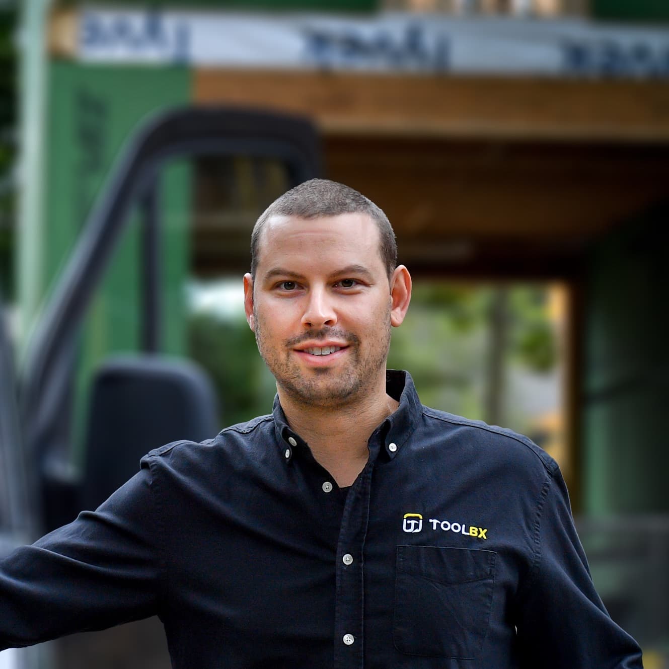 Erik, founder and CEO of Toolbx, in front of a house under construction